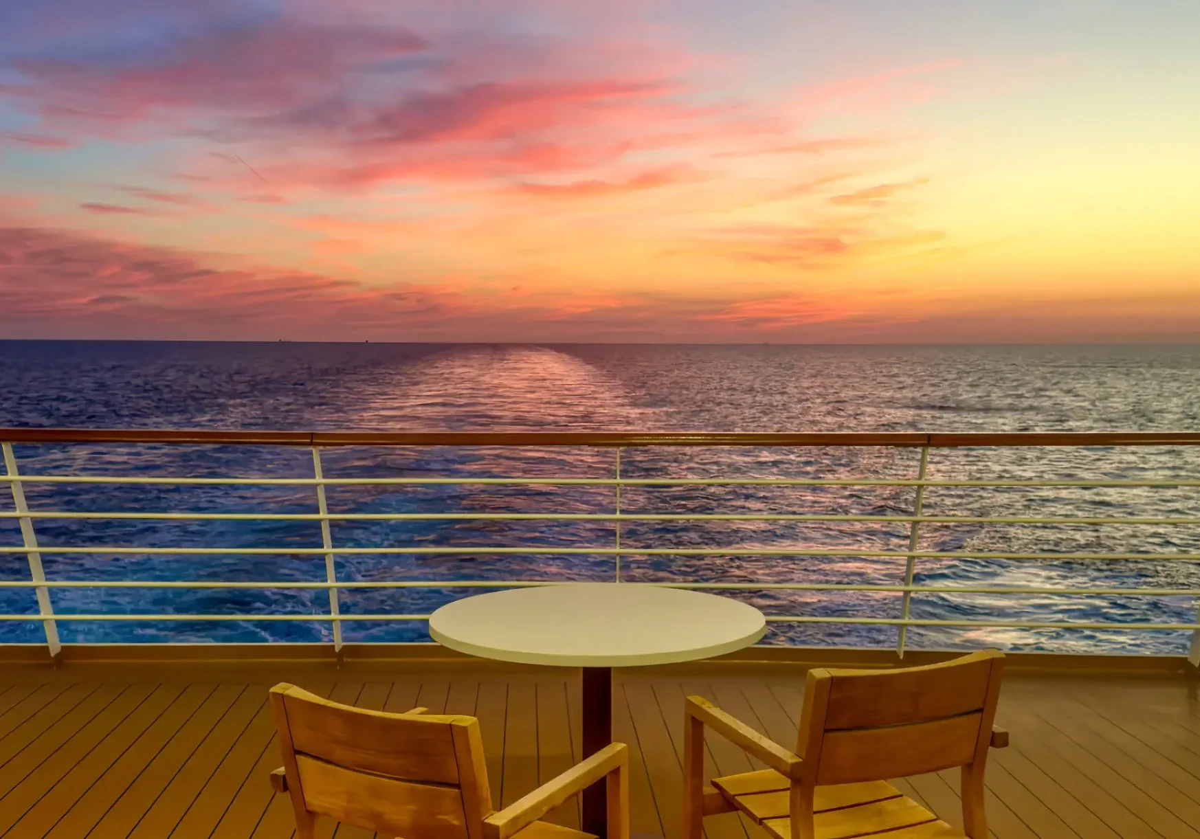 Cruise ship deck with chairs at sunset
